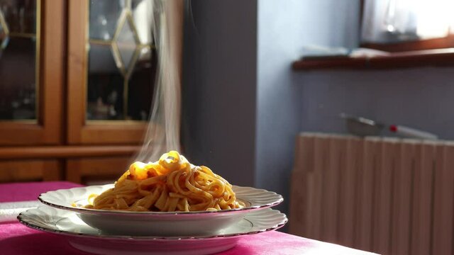 italian traditional cooking, steaming Bolognese noodles close-up shot