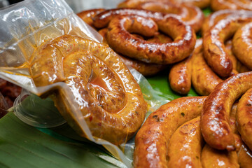 Wrapped packaging of Sai Aua, Northern Thailand Spicy Sausage, a famous Traditional Local saurage cooked with curry and herb at shop and ready for sales.