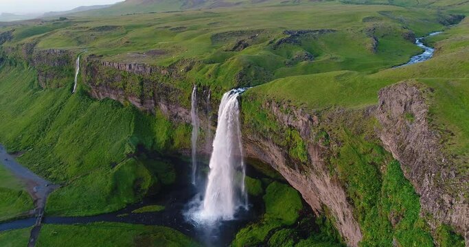 Iceland Aerial drone 4K video of waterfall Seljalandsfoss in Icelandic nature. Famous tourist attractions and landmarks destinations in Icelandic nature landscape in South Iceland