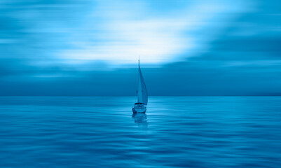 Fototapeta premium A white sailing yacht (boat) on the calm sea with storm clouds