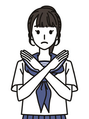 Fototapeta premium 手でばつのジェスチャーをするセーラー服の女子中学生・高校生