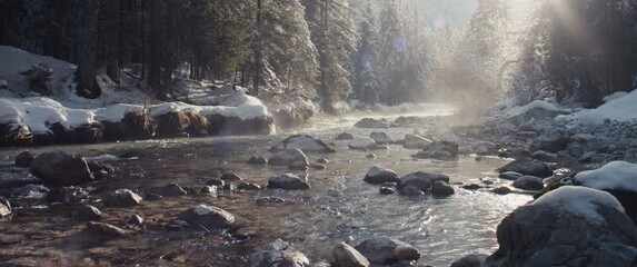 Misty Alps river winter snow evening sun shines riverbed pure water - Powered by Adobe