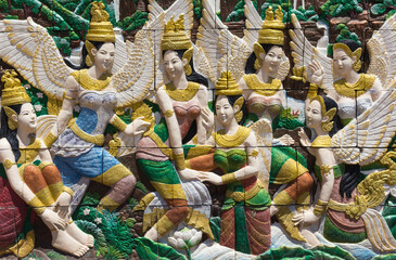 Thai culture stone carving on wall
