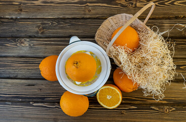Photo, Flat Lay Oranges and Juicers on a wooden brown background
