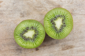 Fototapeta na wymiar Kiwi fruit on wooden background
