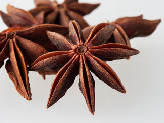 Star anise and cinnamon stick isolated on white background, top view