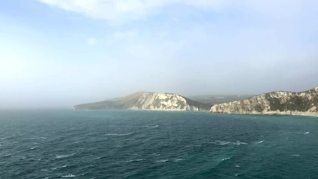 Panoramic aerial view of chalk cliffs and the ocean on the coast of Dorset, England