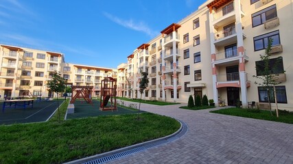 Apartment in residential building exterior. Housing structure at blue modern house of Europe.