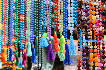 colorful rosary made of precious stones and glass in a indian market