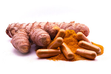turmeric capsule, curcuma powder and tumeric rhizome,(Curcuma longa), isolated on white background. curcumina