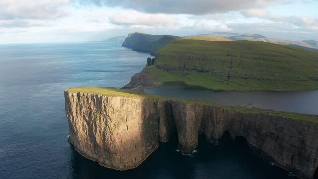 Sunrise at Sorvagsvatn or Leitisvatn lake at sunrise. Faroe Islands, aerial.
