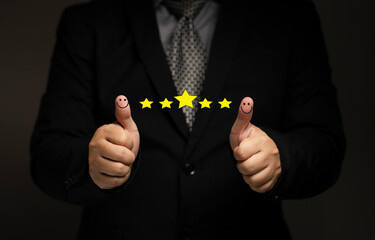Business people thumb up positive thinking score a list of smile and stars for satisfaction. online transactions, network performance, customer satisfaction.