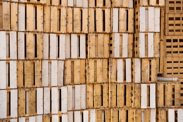 Old and used wooden boxes stacked on top of each other