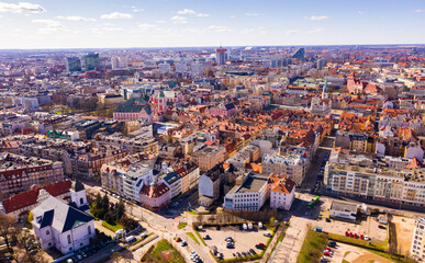 Aerial view of Poznan modern cityscape overlooking new residential areas and historical center on sunny spring day, Poland