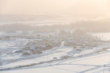 View from the hill to the Yakutsk city in the fog on a cold winter day - 478249100