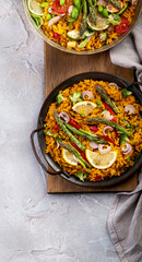 Vegan Paella on gray background.