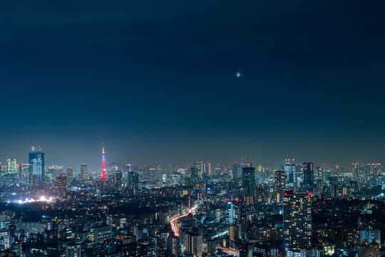 Wide panorama image of Tokyo night view with Lunar ecripse