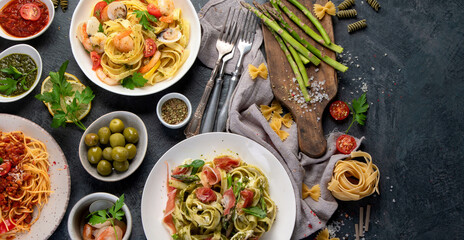 Pasta assortment on dark background.