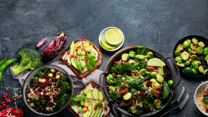 Vegan dishes assortment on gray background.