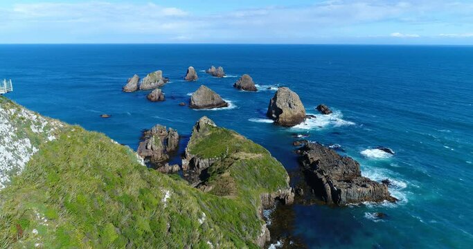 New Zealand aerial drone footage of Nugget Point Lighthouse in Otago region and peninsula on South Island, New Zealand. Beautiful tourist destination and attraction
