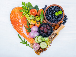 Heart shape of ketogenic low carbs diet concept. Ingredients for healthy foods selection on white...