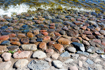 shore with granite cobblestones texture  - 478251112