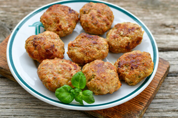 Home made  fried meatballs   on wooden rustic background.Cutlets from beef and pork meat.