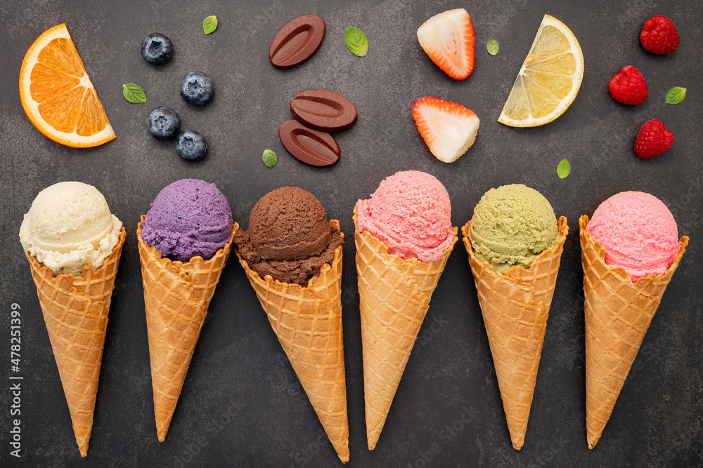 Aufkleber flat lay ice cream cones collection on dark stone background . blank crispy ice cream cone with copy