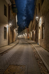 Narrow medieval Boksto street and star sky