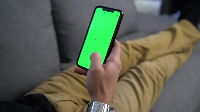 Man Swiping on Smart Phone Green Screen Tracking Points