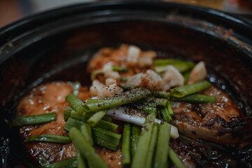 Close up Vietnamese Fish Simmered in Caramel Sauce. Delicious Vietnamese clay pot fish with sauce...