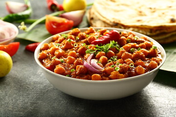 Indian street foods background- chickpeas curry, chana, channa, masala served with chapathi,
