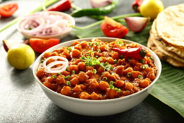 Indian street foods background- chickpeas curry, chana, channa, masala served with chapathi,
