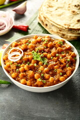 Homemade delicious  wholesome vegetarian diet meal- chana masala, chickpea curry served with whet chapati.