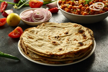 Indian chapati, chapathi - Homemade whole wheat flat bread served with vegetable curry.