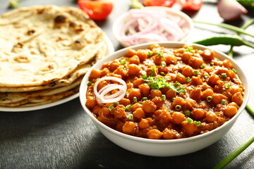 Chana masala- Indian traditional chickpeas curry with exotic spices and herbs.