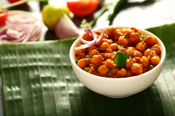 Indian vegetarian cooking- homemade spicy chickpeas curry, chana, channa, masala,