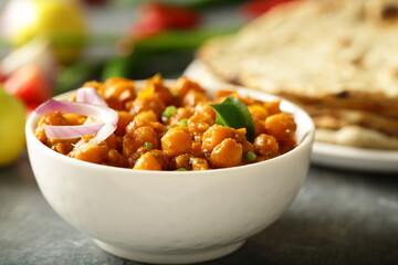 Bowl of delicious chickpeas curry, chana masala, Indian vegetable cooking recipes.