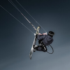 Fototapeta na wymiar 12 of March 2017, Russia, Tomsk, kiter jump up within kite