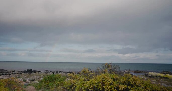 Autumn Rainbow By The Shore of V&aring;rhallarna in South Sweden &Ouml;sterlen - Wide Shot Panning From Left To Right