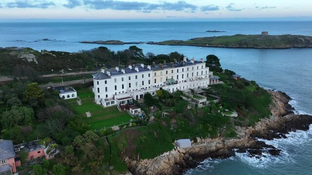 Sorrento Terrace, Killiney, Ireland. December 2021 Drone gradually orbits the row of houses from the southwest with Dalkey Island and Dublin Bay in the background.