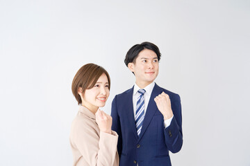 ビジネスウーマンとビジネスマン　ガッツポーズ
