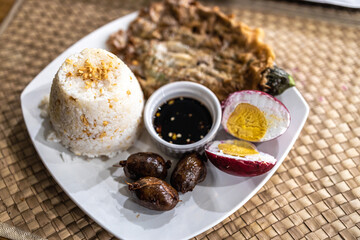 Popular Filipino food Tortang talong with rice and salted egg