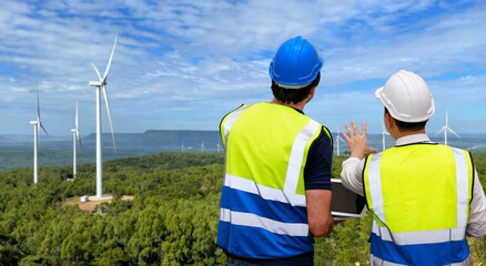 Windmill engineer man and worker standing and planing renewable energy technology or alternative...