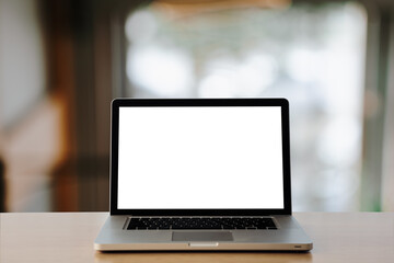 Fototapeta premium laptop on the table,office background for light bokeh. 