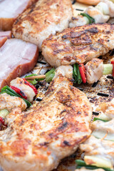Chicken breast and pork meat pulled in wooden skewer with fresh colorful and tasty vegetables
