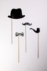 Black hat smoking pipe moustache blue neck bow tie shape paper die cut selfie portrait party fun paper prop sticker stick on white background