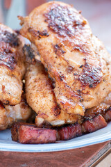 Chicken breast and pork meat pulled in wooden skewer with fresh colorful and tasty vegetables