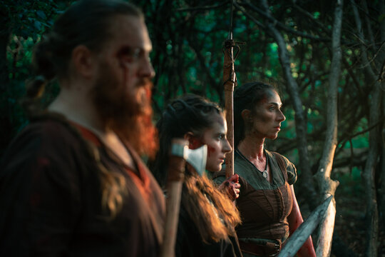 Brave vikings with weapons during battle