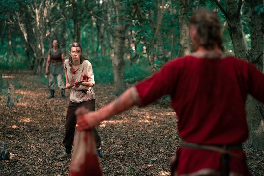 Vikings fighting in forest for historic reenactment